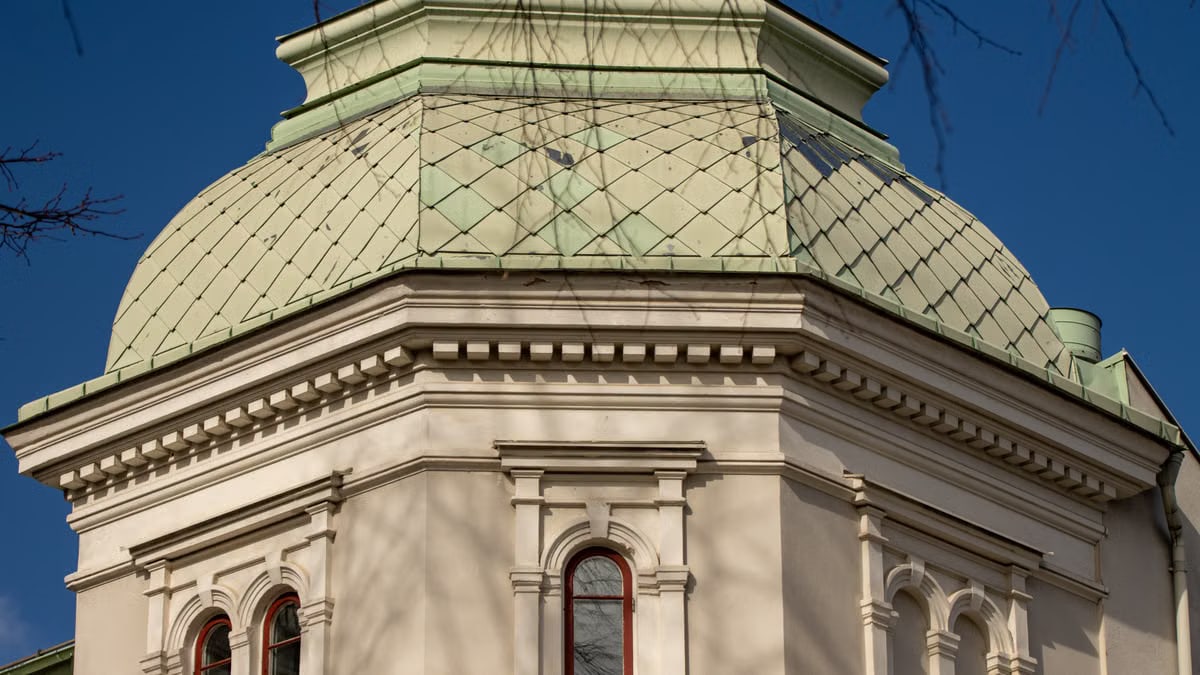 Close-up of an architectural dome with ornate design in Jönköping, Sweden, under blue sky.